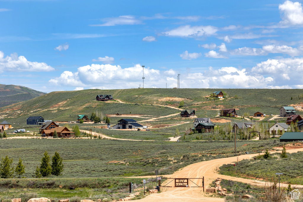 View of mountain backdrop with rural landscape