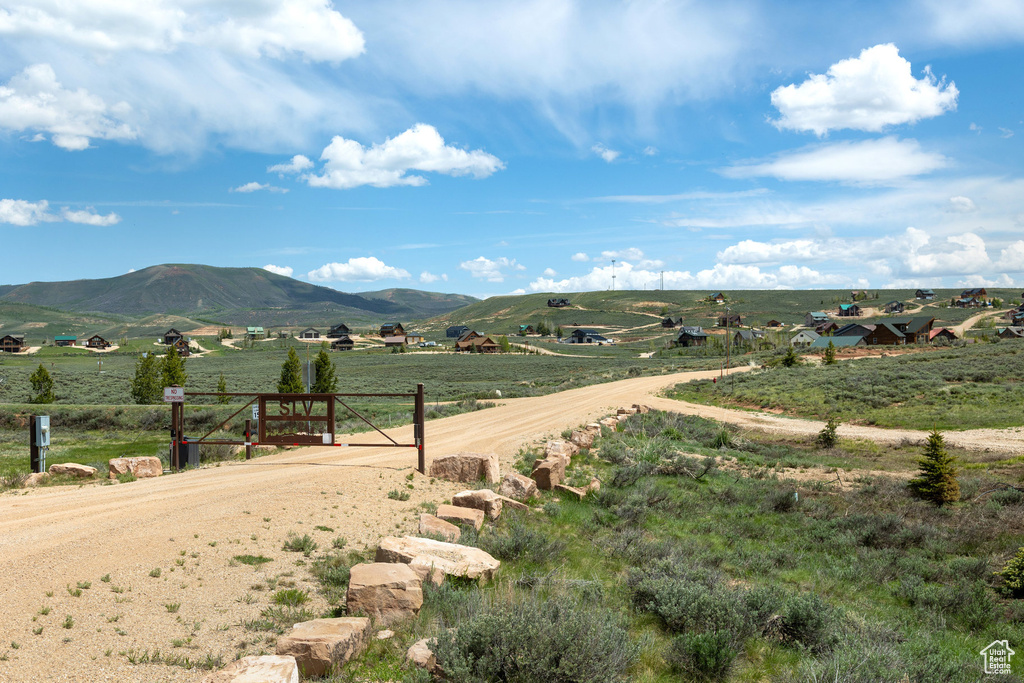 View of mountain background featuring rural landscape