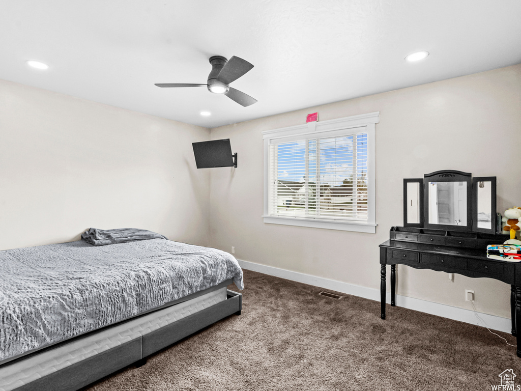 Bedroom with carpet flooring, baseboards, recessed lighting, and a ceiling fan