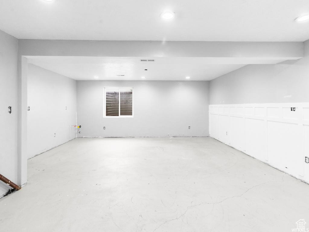 Finished basement featuring recessed lighting