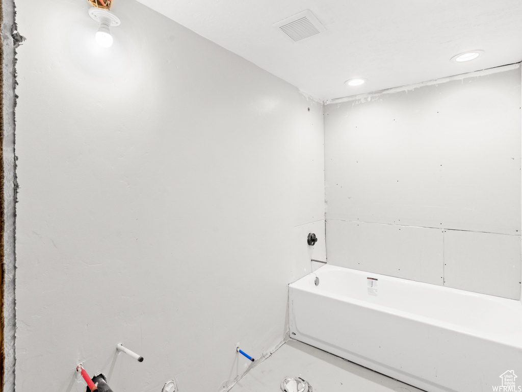 Full bathroom with a bath and recessed lighting