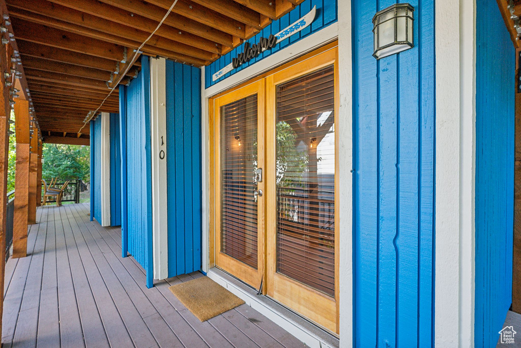 Wooden terrace featuring french doors