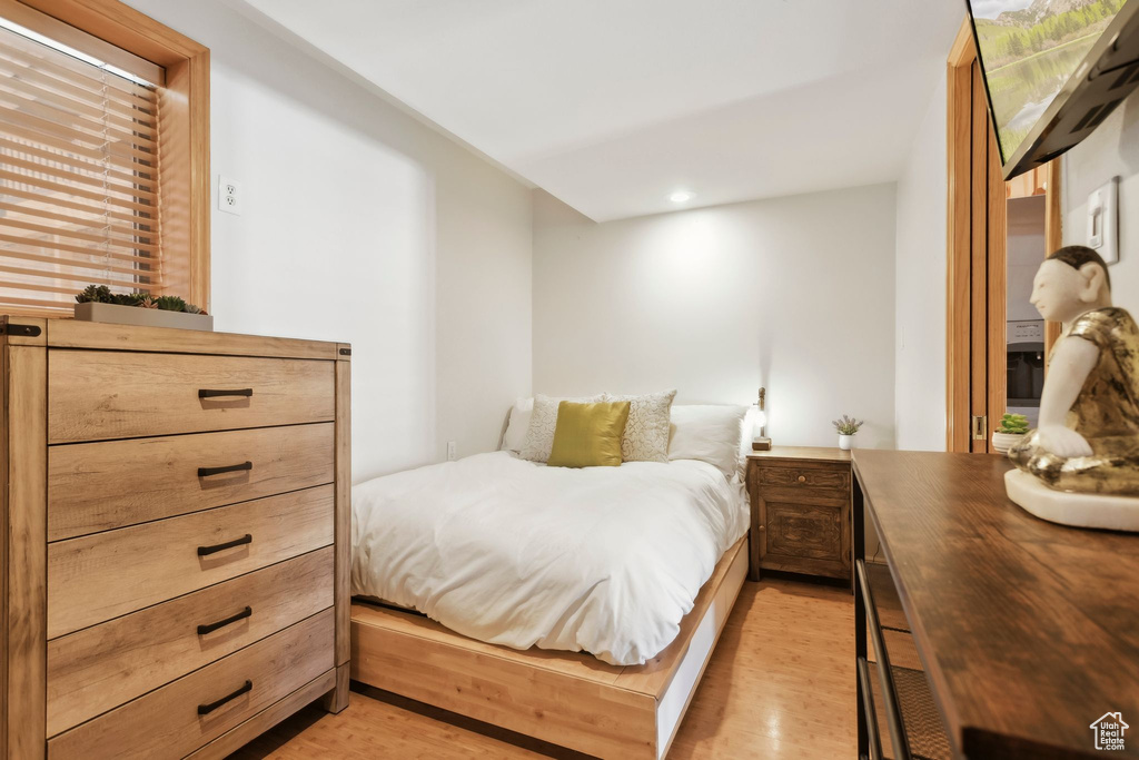 Bedroom with light wood-style flooring and recessed lighting