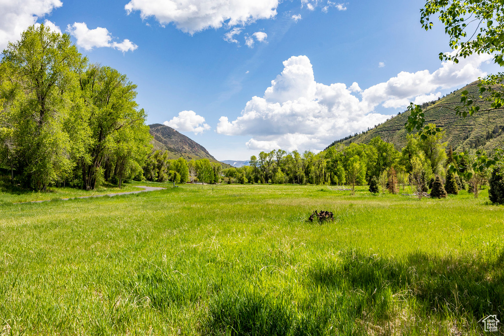 View of mountain background featuring rural landscape