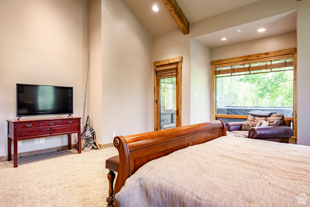 Bedroom featuring recessed lighting, beam ceiling, carpet flooring, multiple windows, and access to outside