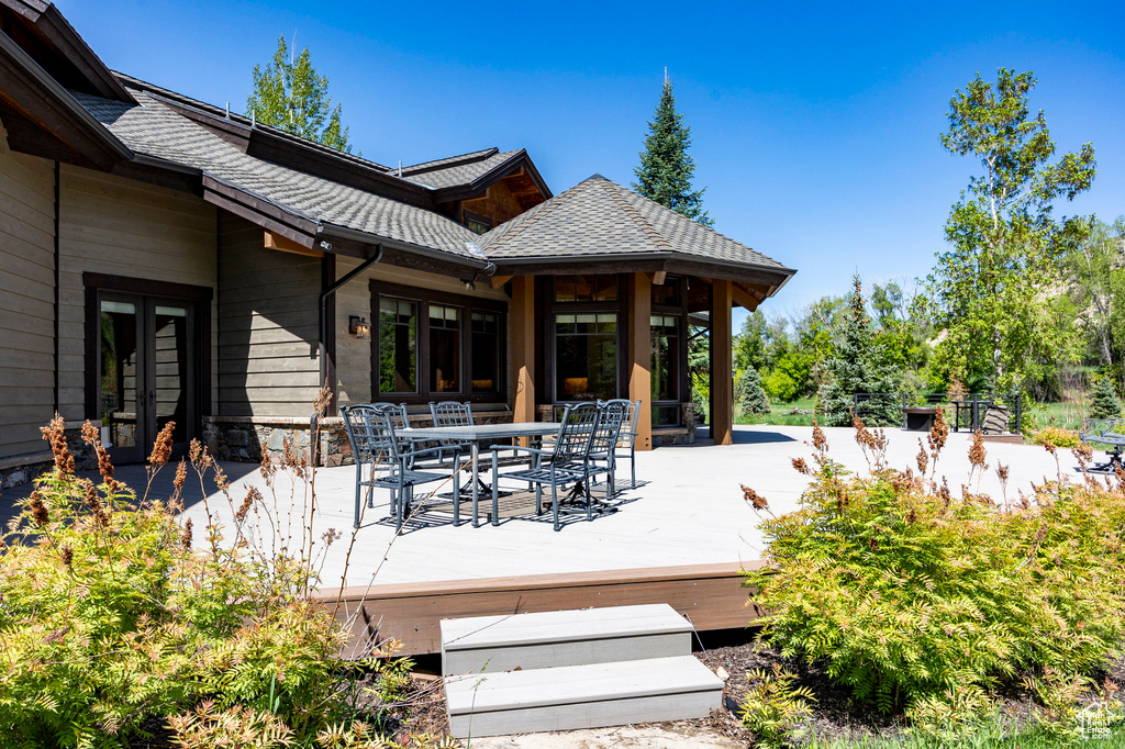 Deck with outdoor dining area and french doors