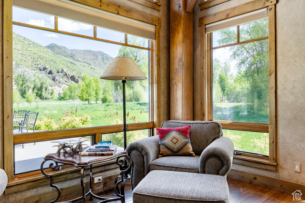 Sitting room featuring a mountain view, hardwood / wood-style floors, and plenty of natural light
