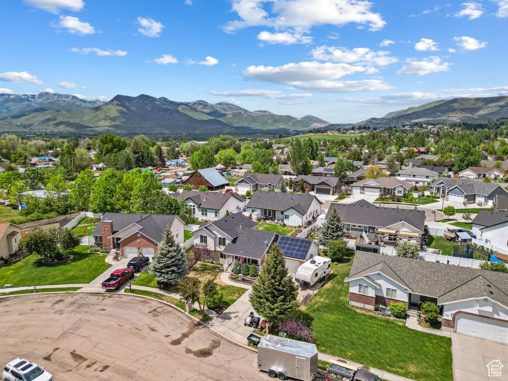 Aerial perspective of suburban area with a mountain backdrop