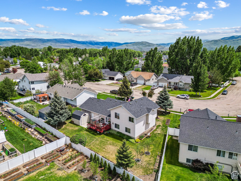 Aerial perspective of suburban area featuring a mountainous background