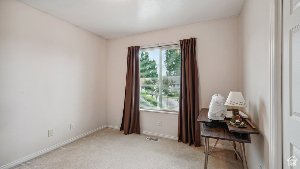 Office with light carpet and baseboards