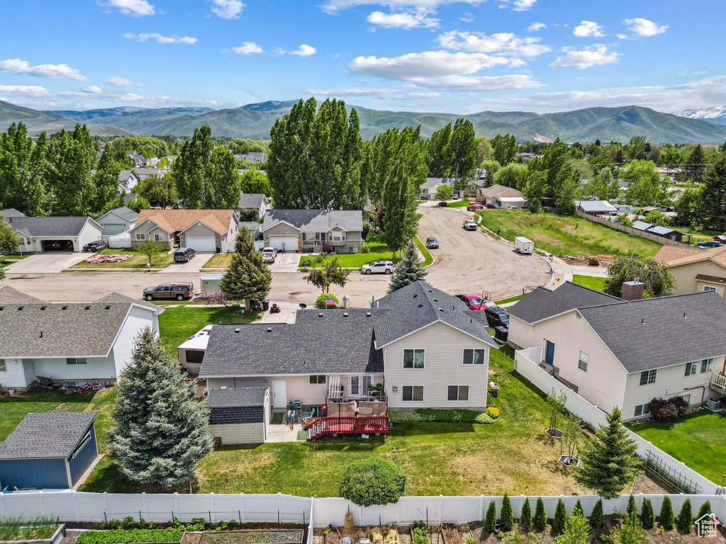 Aerial view of residential area featuring a mountainous background