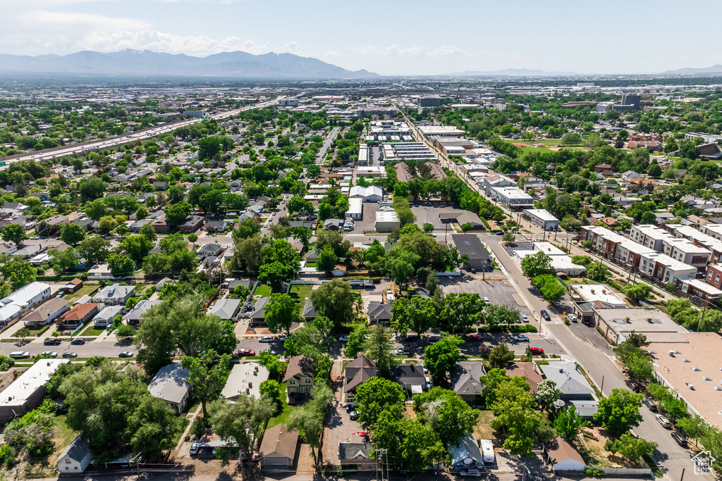 Aerial perspective of suburban area with a mountainous background