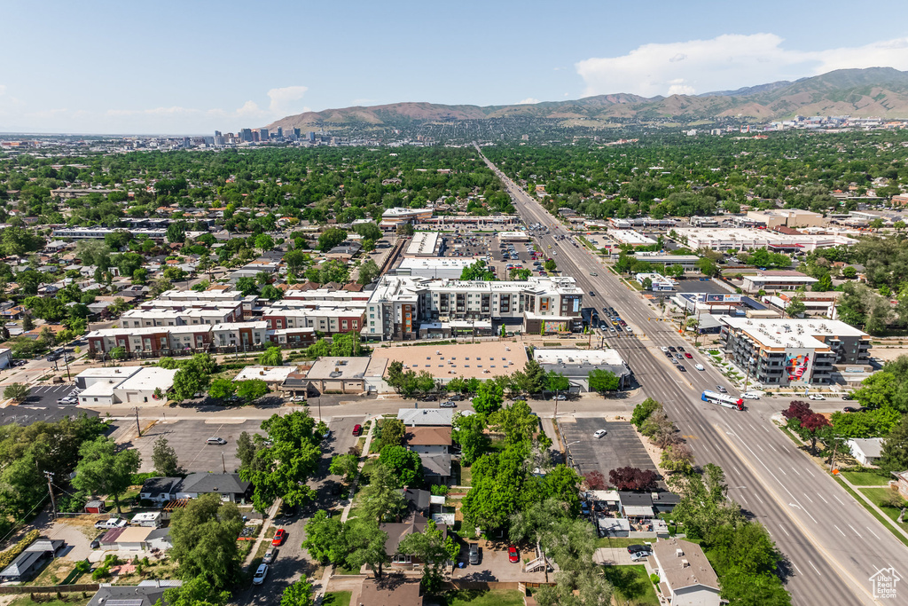 View of urban area featuring a highway and mountains