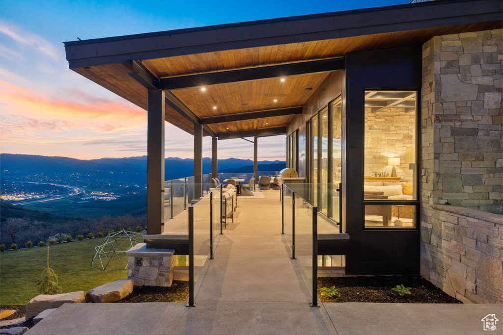 Patio terrace at dusk with a mountain view