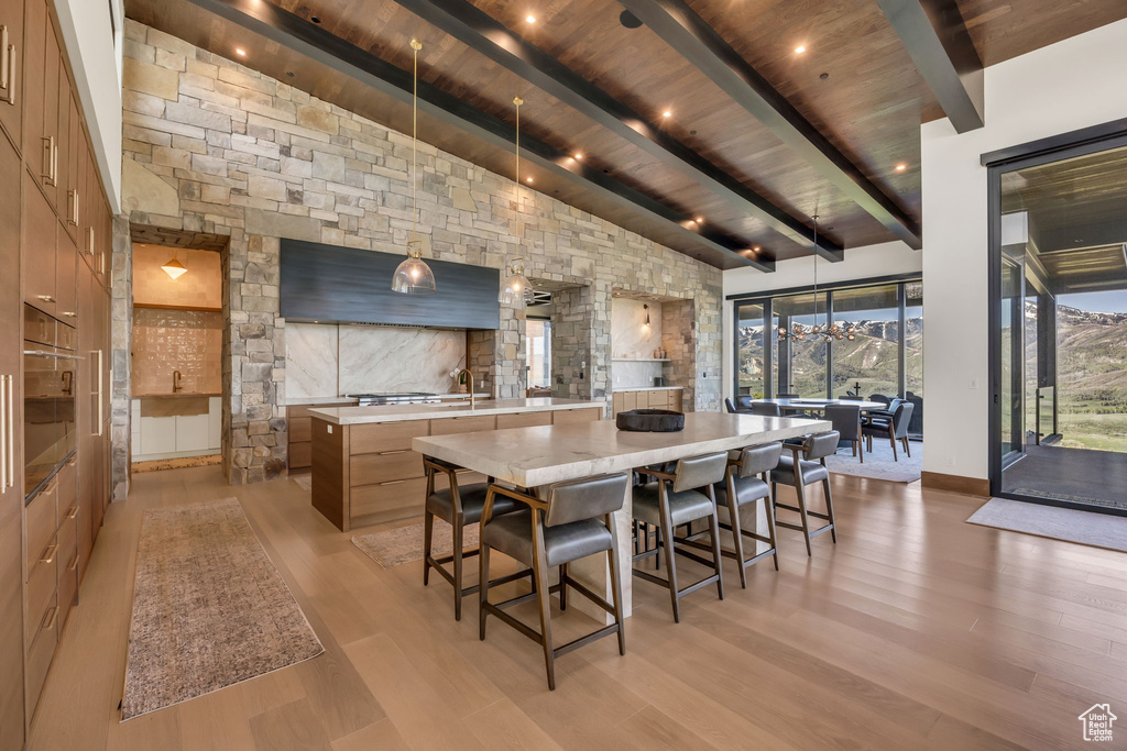 Dining room with wood ceiling and light wood finished floors