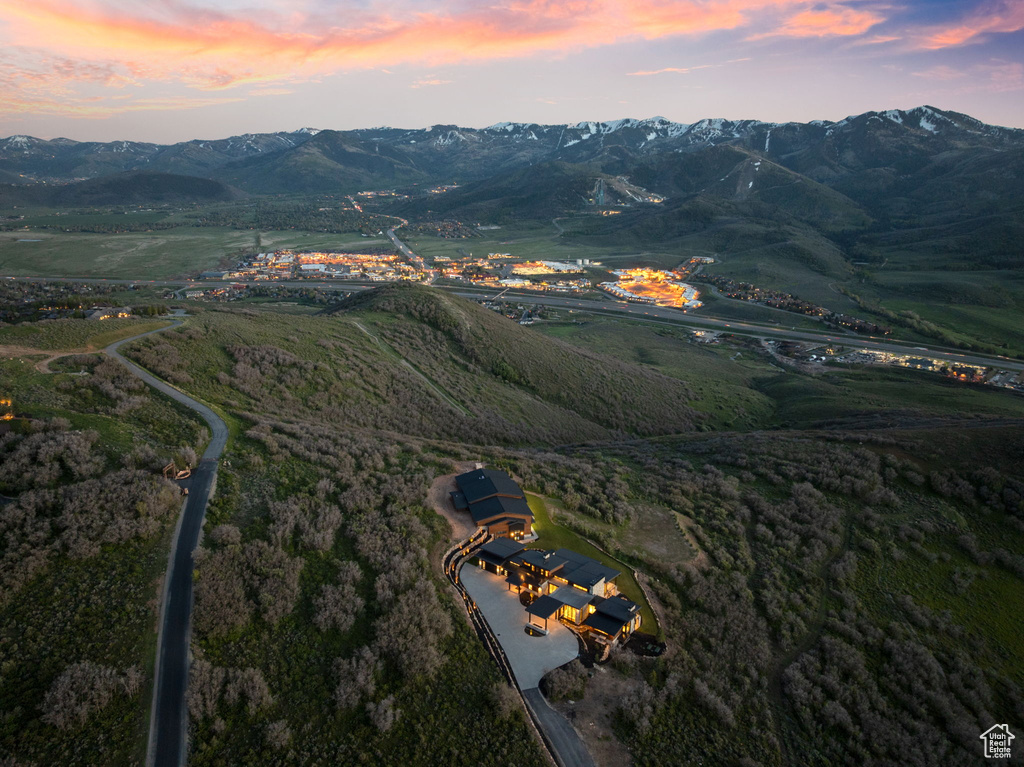 Aerial view of property's location with a mountainous background