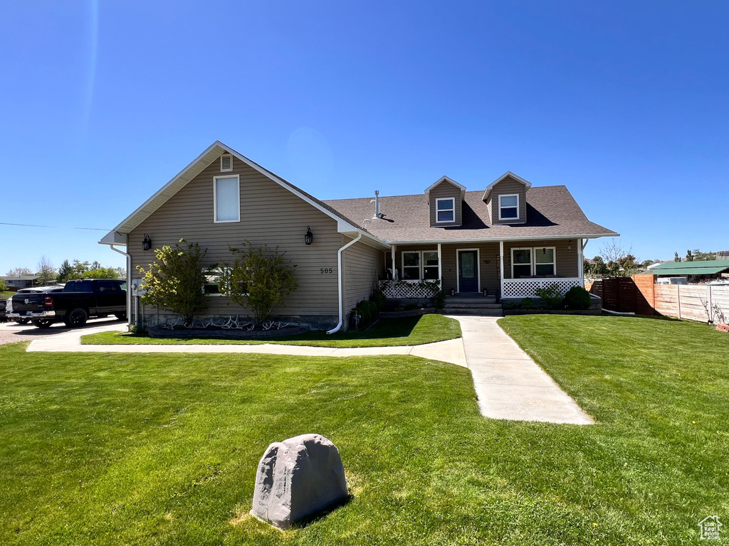 View of front of home featuring a porch and roof with shingles