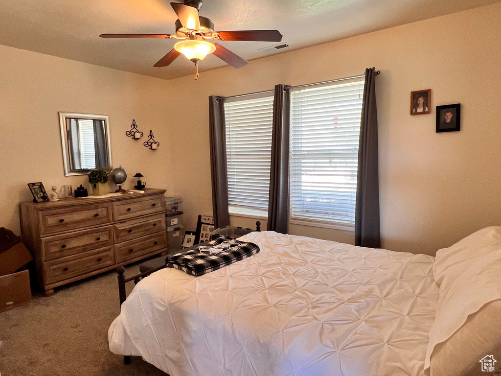 Bedroom with carpet floors and ceiling fan