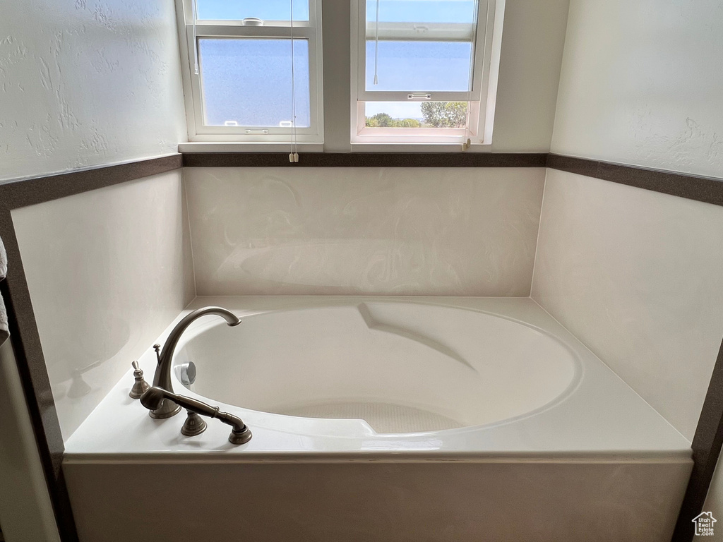 Full bathroom with a bath