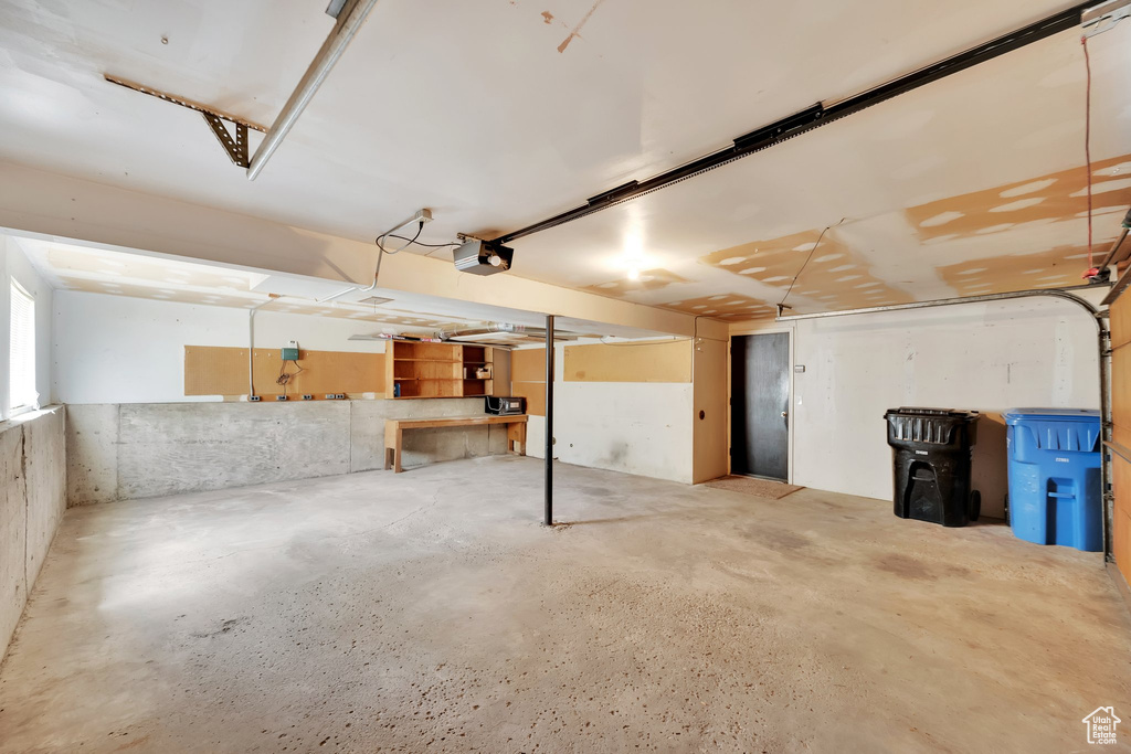 Garage featuring a garage door opener