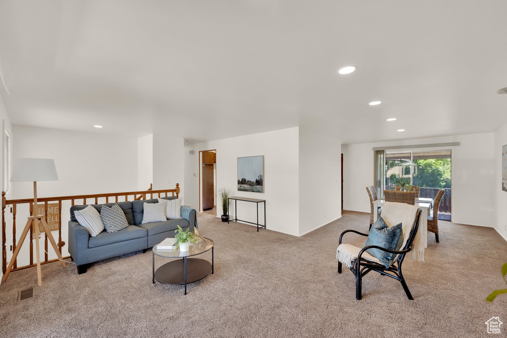 Living area featuring carpet and recessed lighting