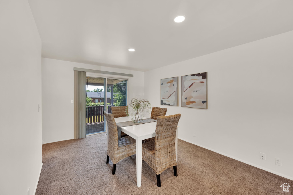 Dining space with light colored carpet, recessed lighting, and baseboards