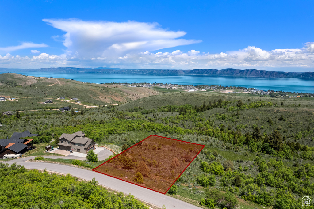 Aerial view of property\'s location with a water and mountain view and property parcel outlined