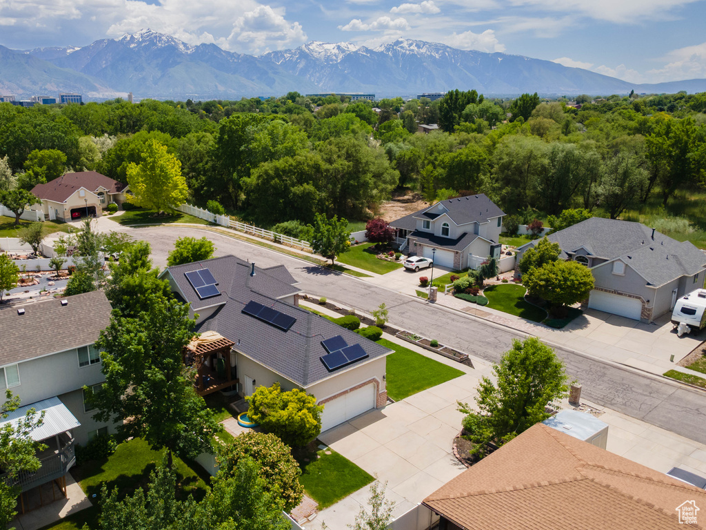 Aerial view of residential area featuring a mountain backdrop
