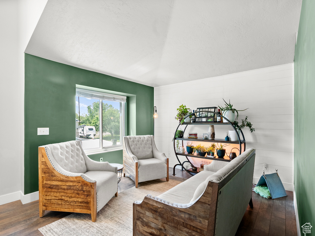 Sitting room with hardwood / wood-style flooring and baseboards