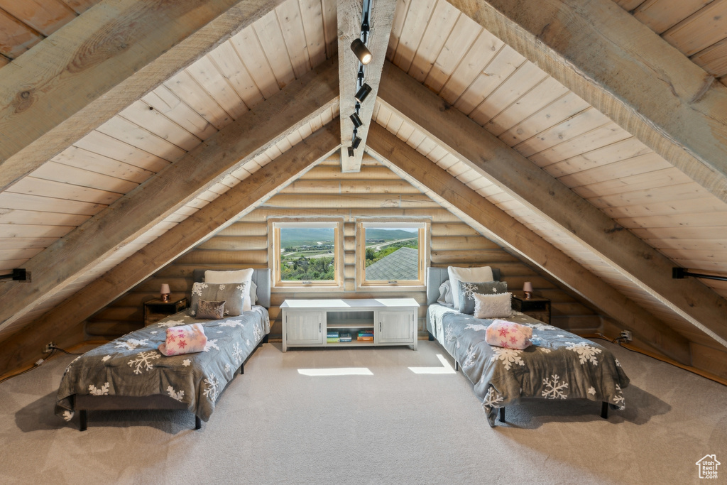 Bedroom with wood ceiling, log walls, and carpet flooring