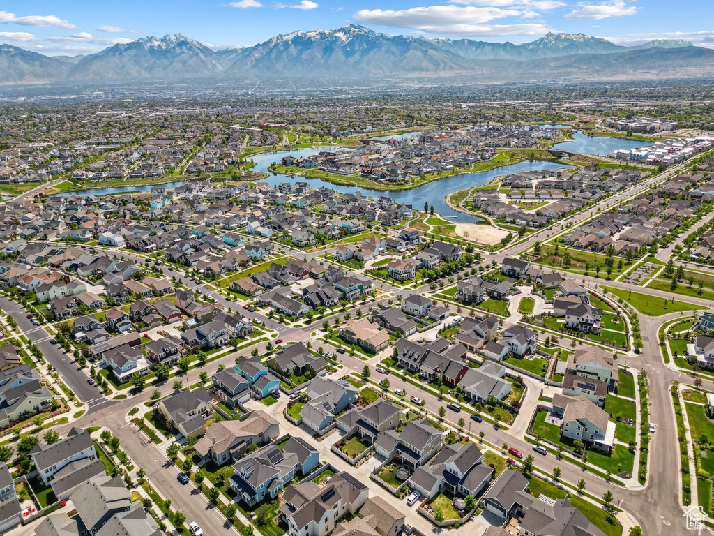 Aerial perspective of suburban area with a water and mountain view
