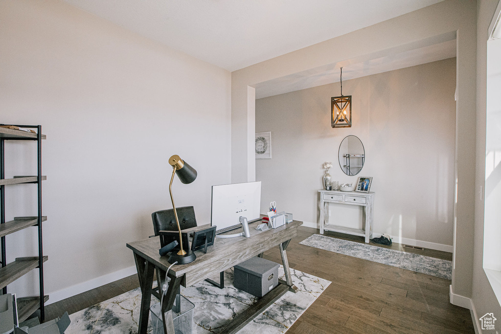 Office area featuring wood finished floors and baseboards