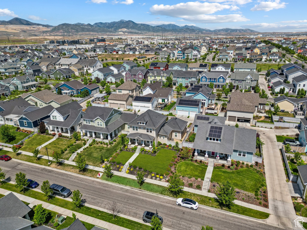 Aerial perspective of suburban area featuring a mountainous background
