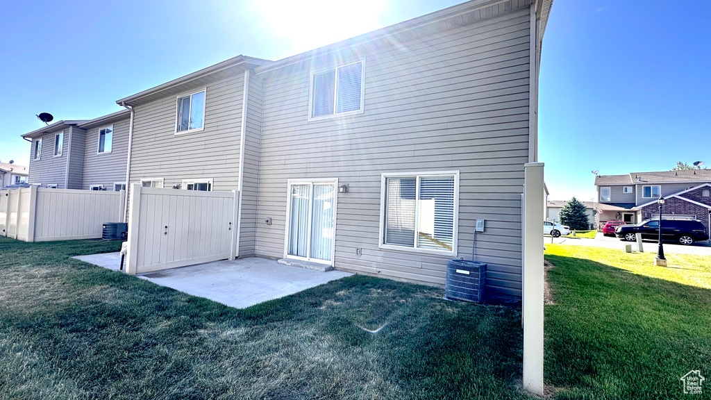 Rear view of property with a patio and central air condition unit