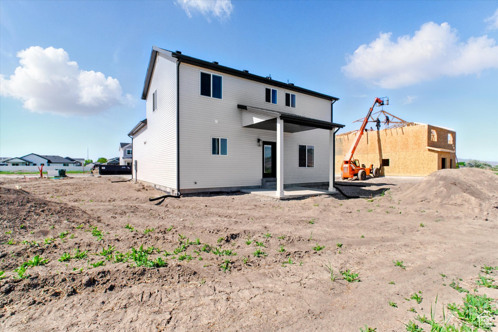 Rear view of property with a patio