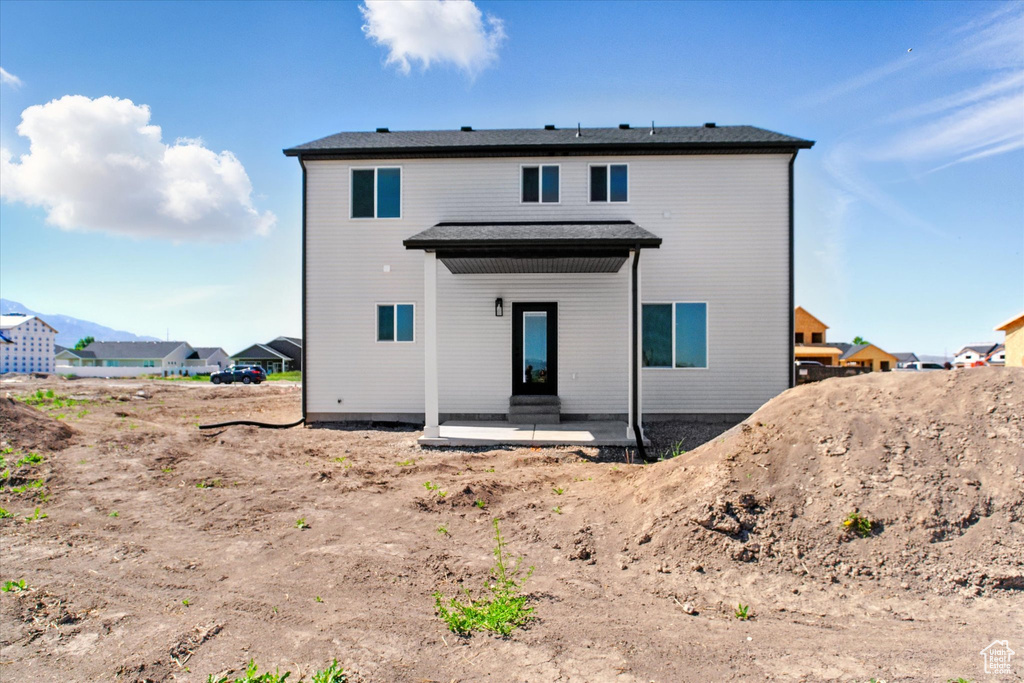 Rear view of house featuring a patio