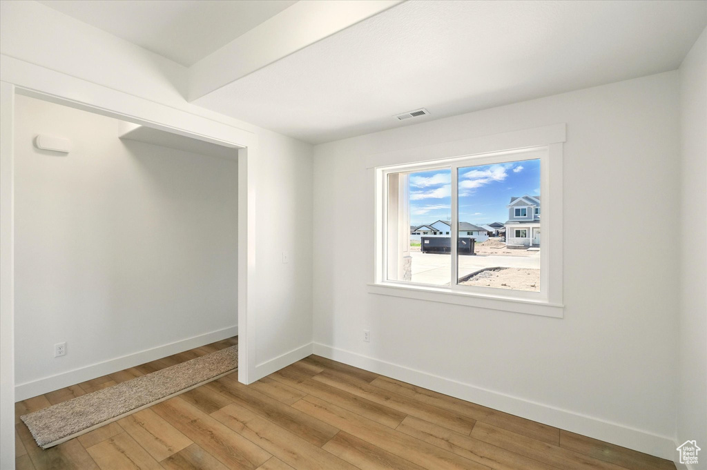 Empty room featuring light wood-style floors and baseboards