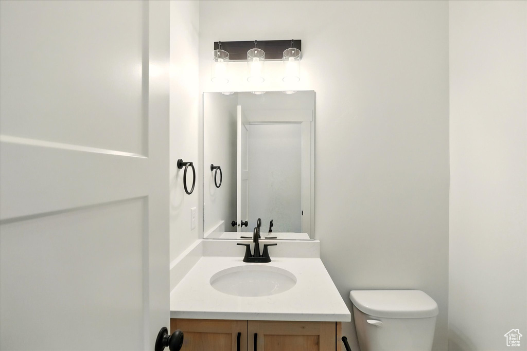 Bathroom featuring toilet and vanity
