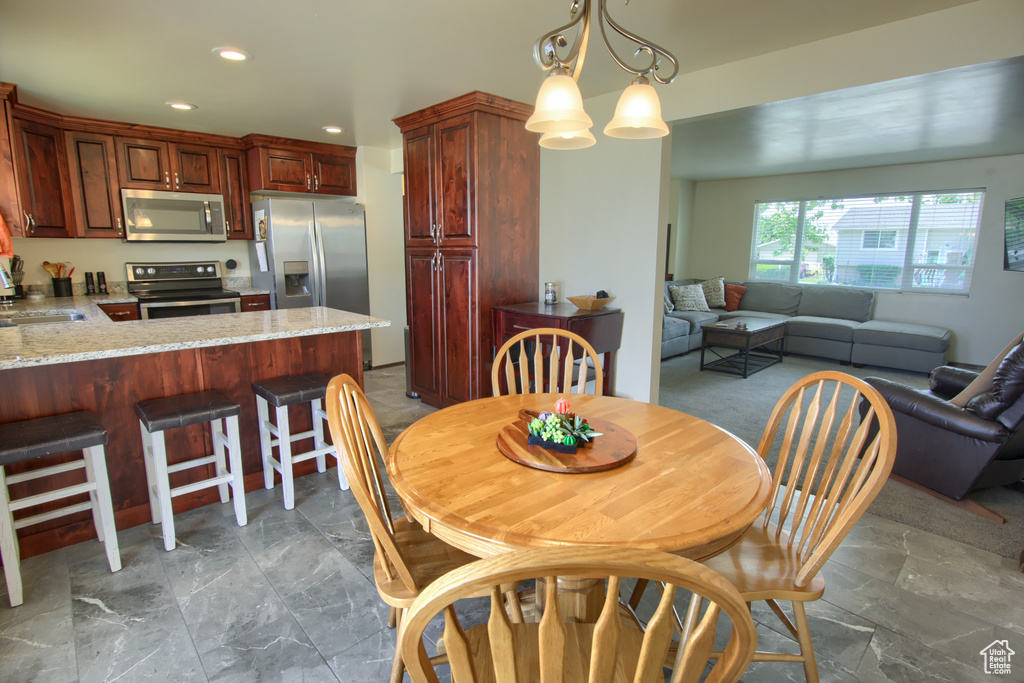 Dining area featuring recessed lighting