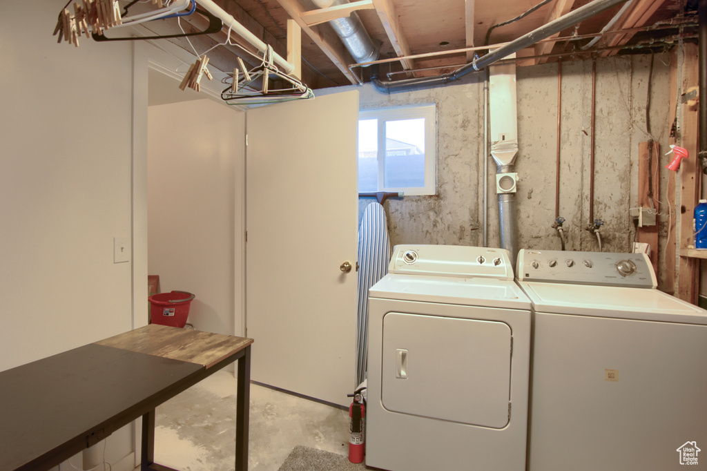 Washroom with washing machine and clothes dryer