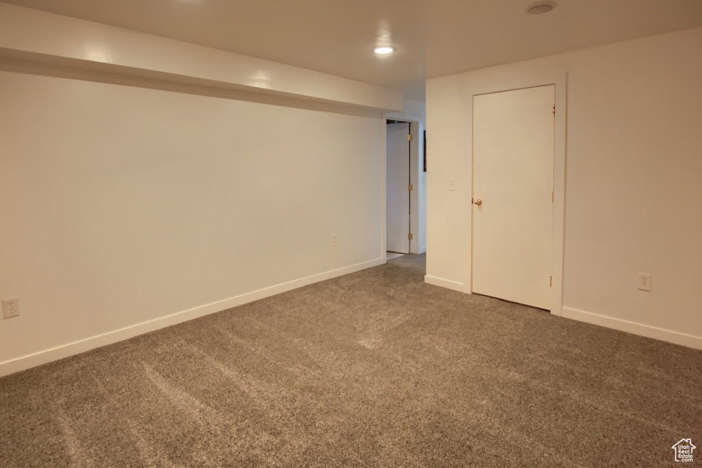 Finished basement featuring carpet flooring and baseboards