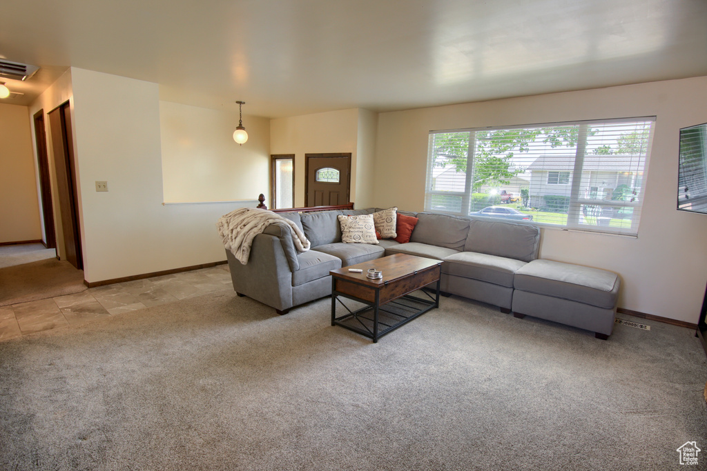 Living room with light carpet and baseboards