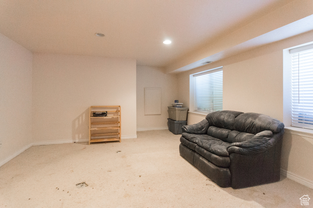 Living area with carpet floors, recessed lighting, and baseboards