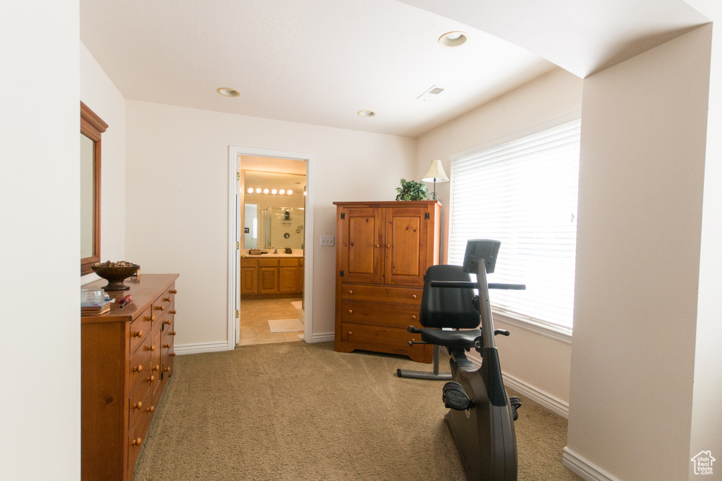 Carpeted office featuring baseboards and recessed lighting