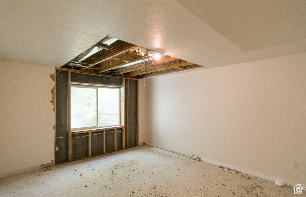Empty room featuring baseboards