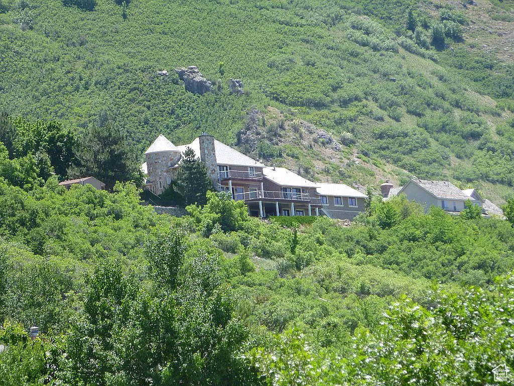 View from above of property with a heavily wooded area