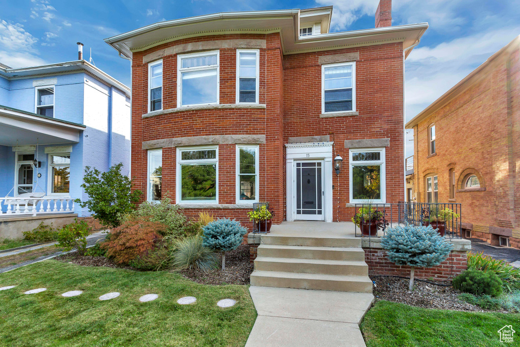 View of front of house with brick siding