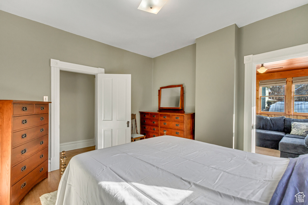 Bedroom featuring light wood-style floors and baseboards