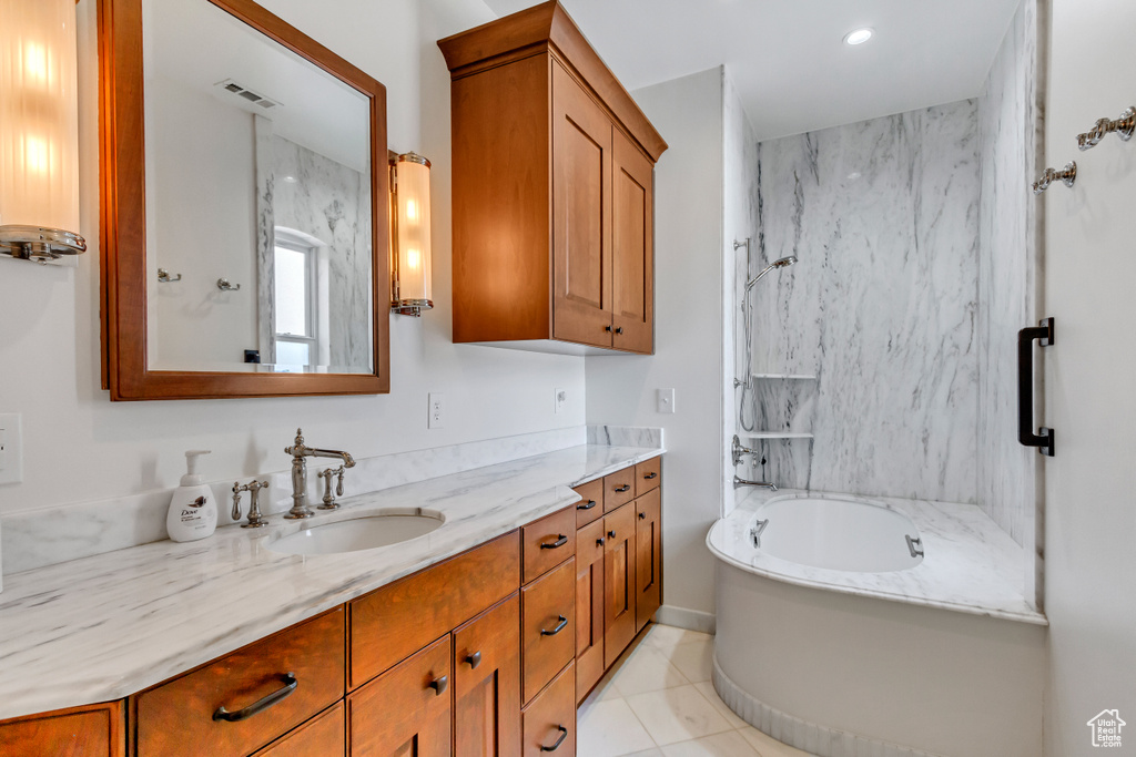 Bathroom featuring vanity, tile patterned flooring, recessed lighting, and a combined bath / shower with marble appearance