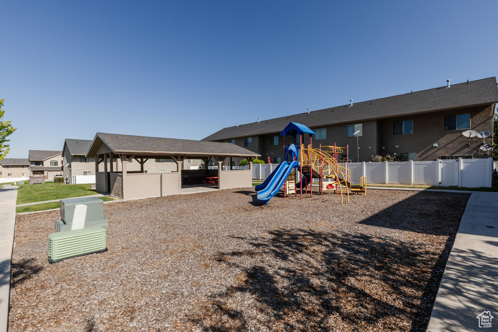 Community play area featuring a gazebo and a residential view